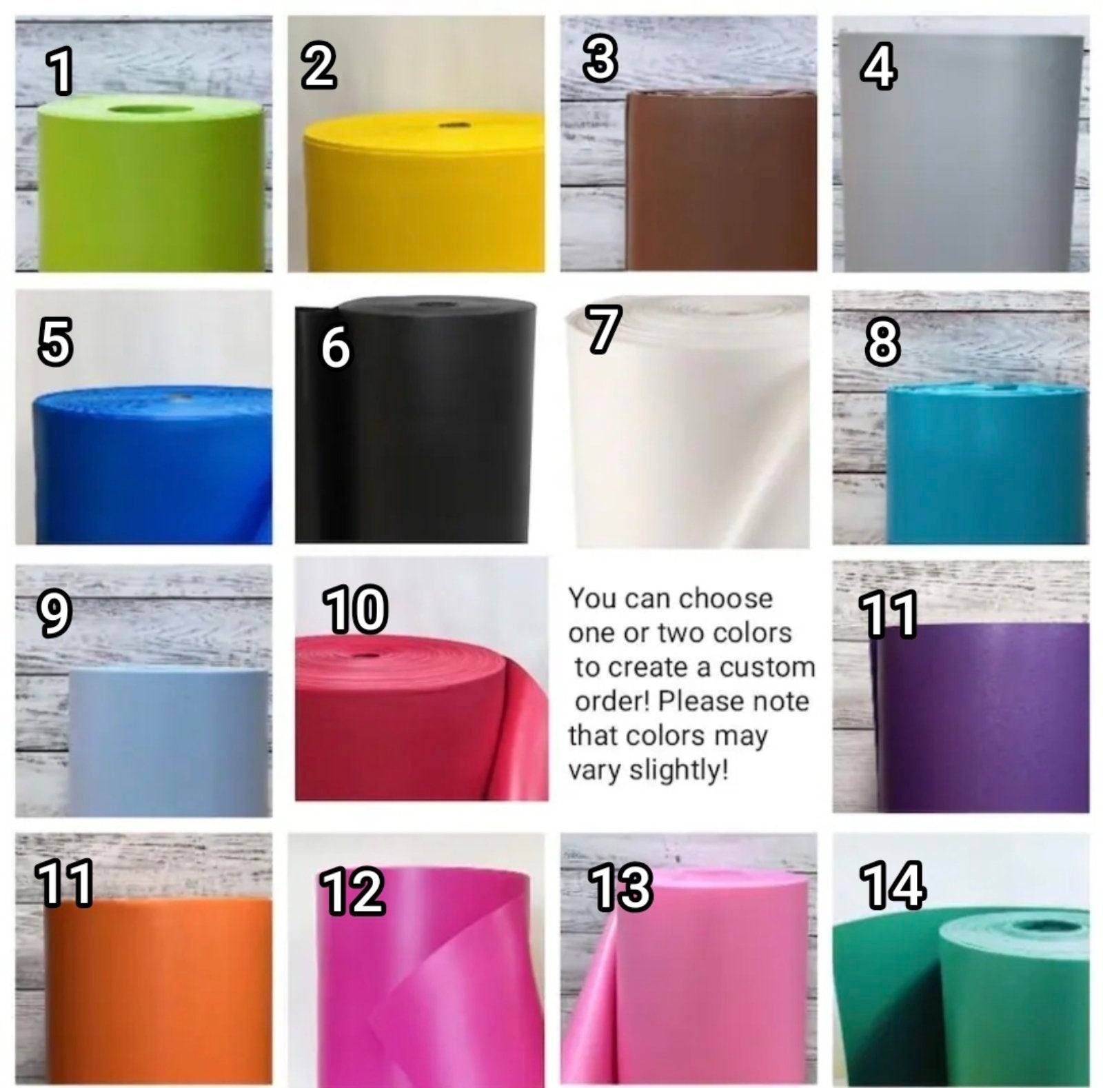 Grid of 14 rolls of fabric in various colors with a wooden background.