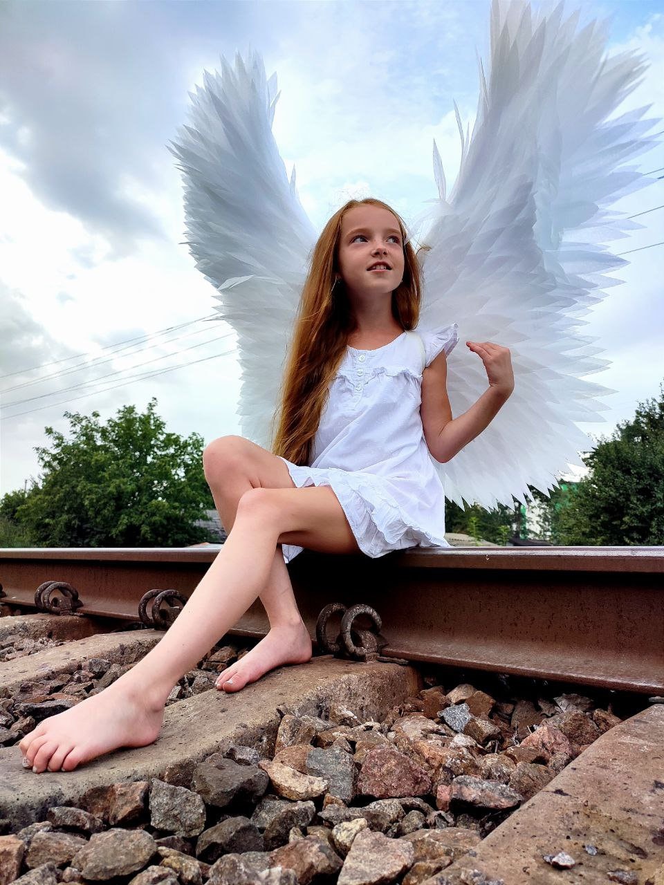 Cruelty-free white angel wings made without real feathers, handcrafted from foamed polyethylene for fantasy costumes.