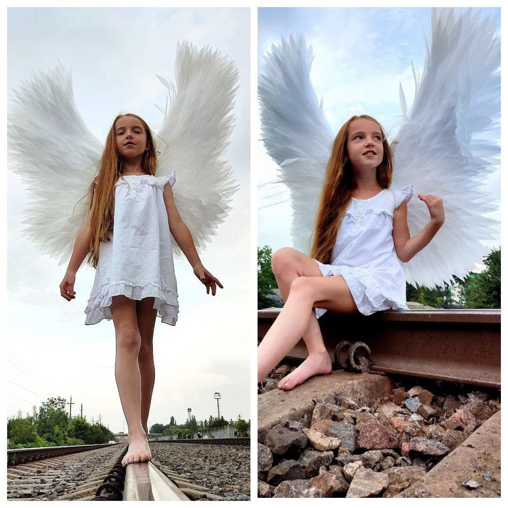 Large white angel wings handmade from individually hand-cut foamed polyethylene feathers for cosplay, Christmas, and fantasy photoshoots.